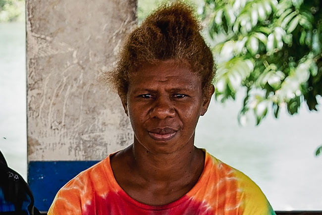 Woman sitting looking at camera